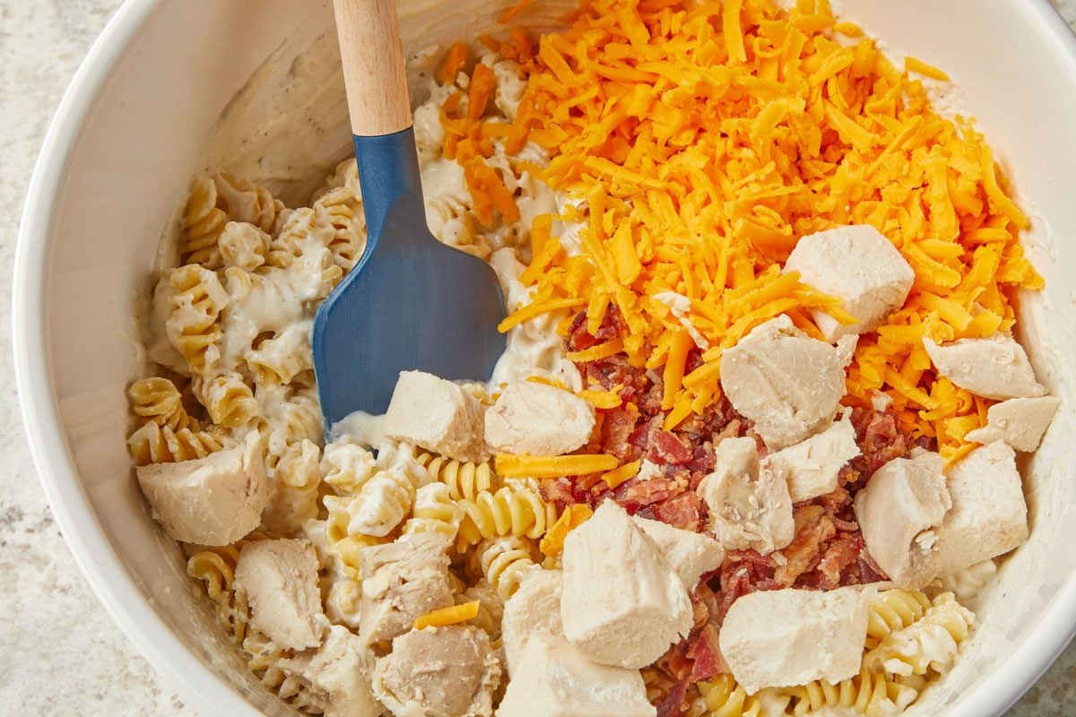 Stir in chicken, bacon and 1 cup Colby cheese.