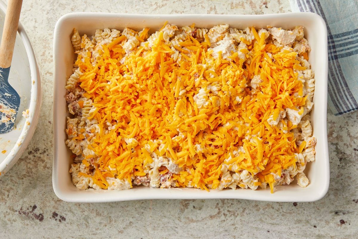 Transfer to a greased 13x9-in. baking dish. Top with remaining 1 cup Colby cheese