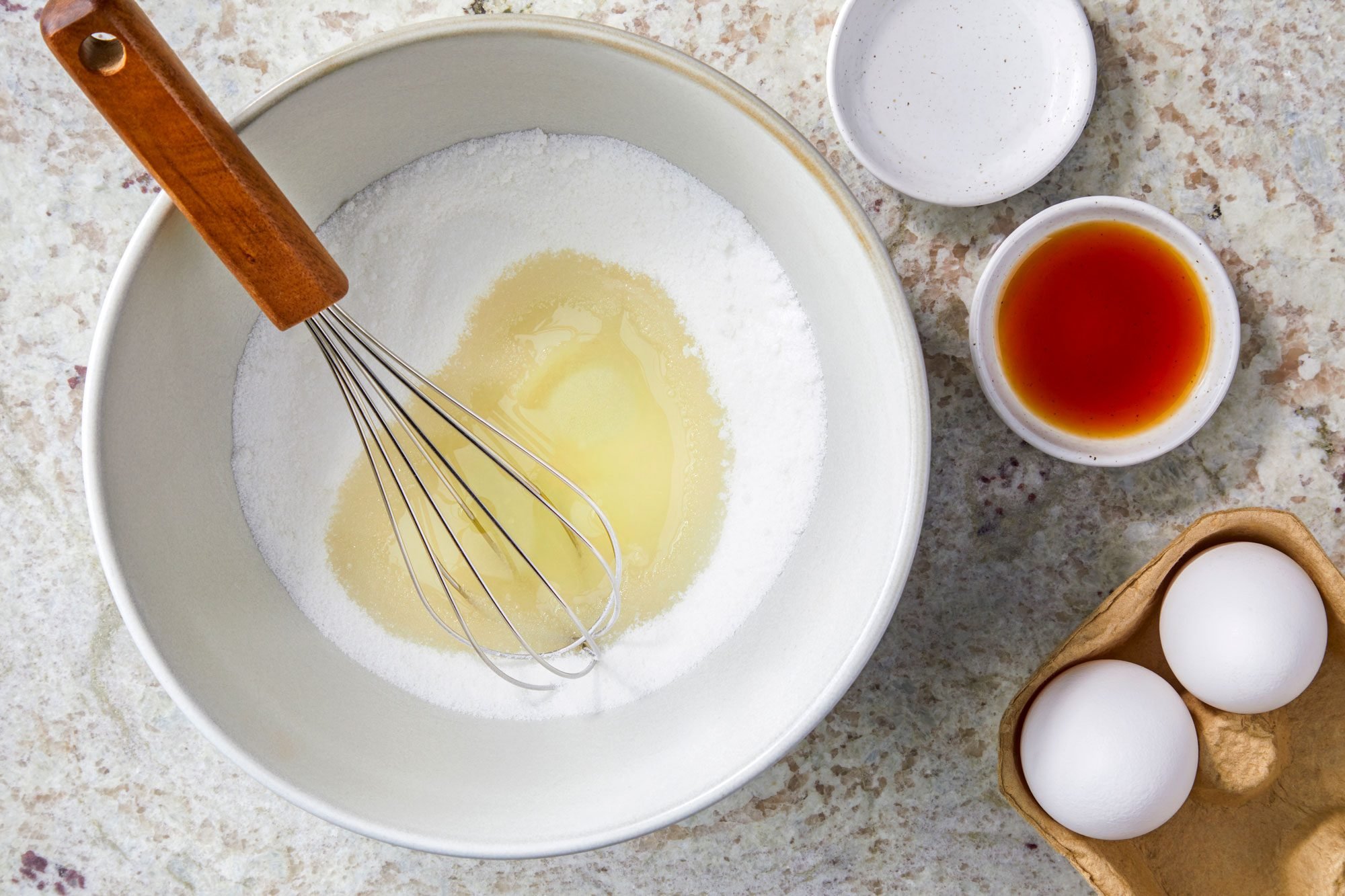 Beat sugar and oil until blended; Beat in eggs; then extracts; whisk tool