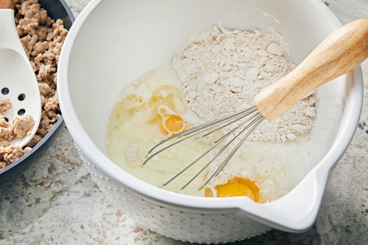 Mix biscuit mix; milk; eggs and oil until blended