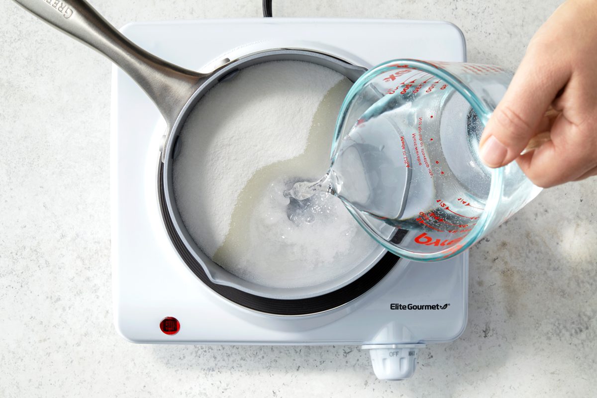 Overhead shot of a small saucepan; combine sugar and water