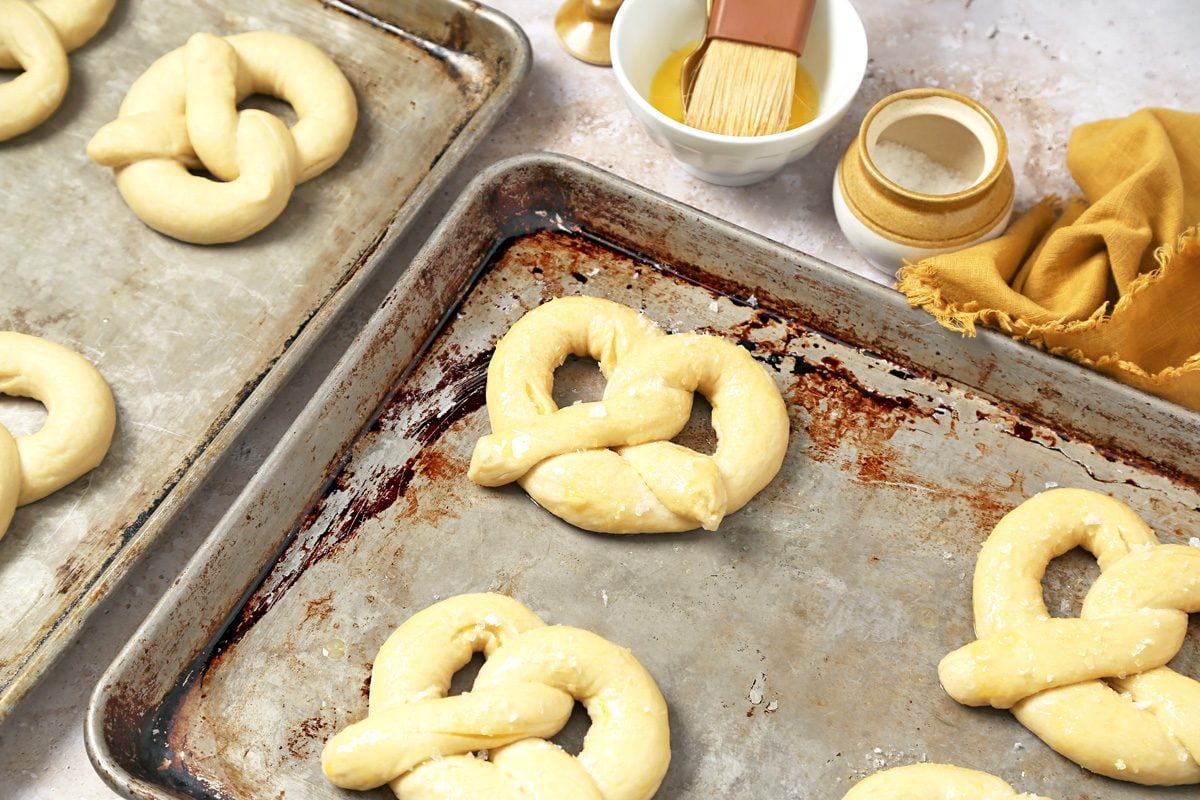 pretzels placed two inch apart on baking sheets