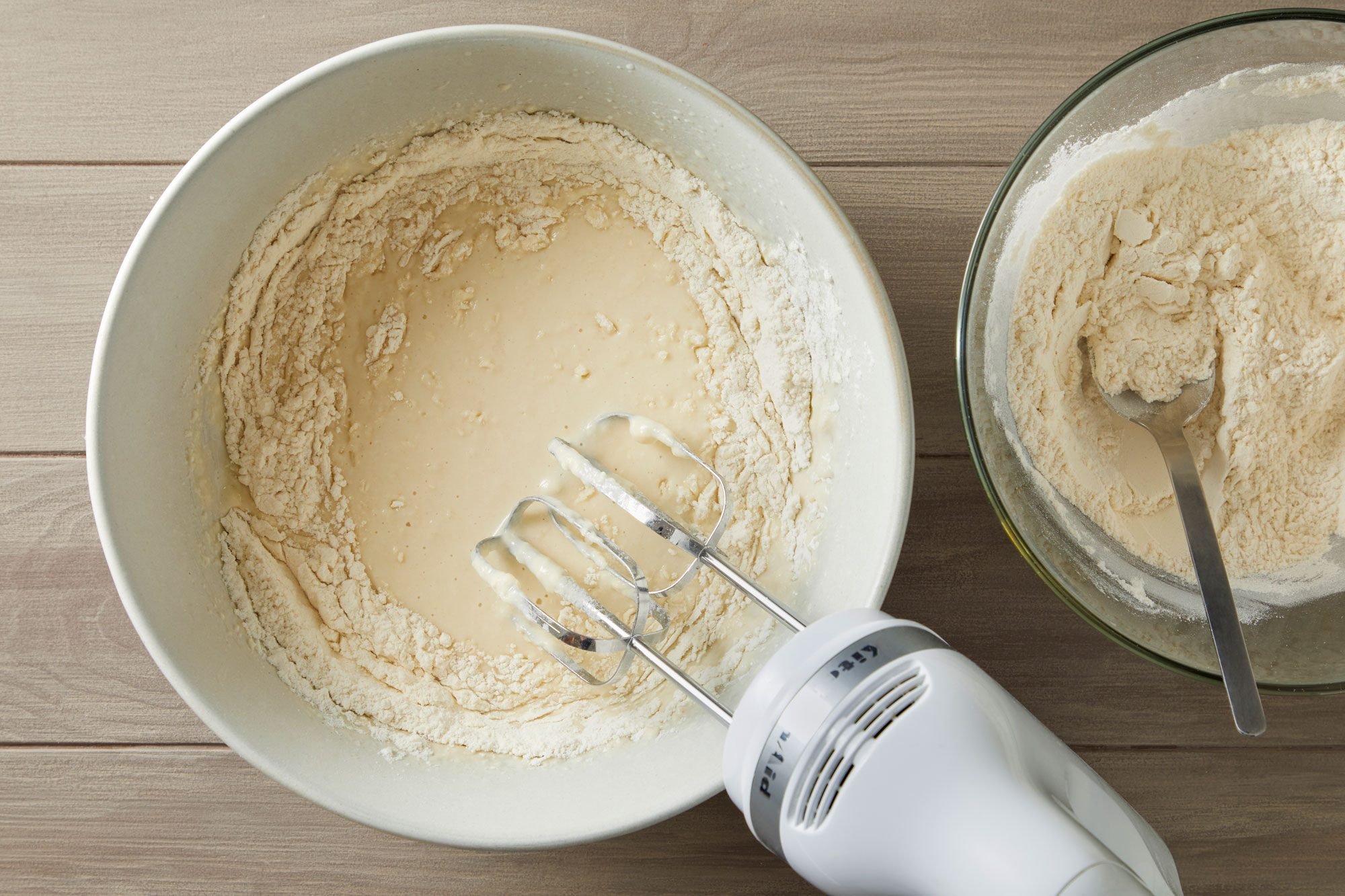 Dissolve yeast in water, add butter, sugar, milk powder and salt. Then beat in 2 cups flour on low for 3 minutes