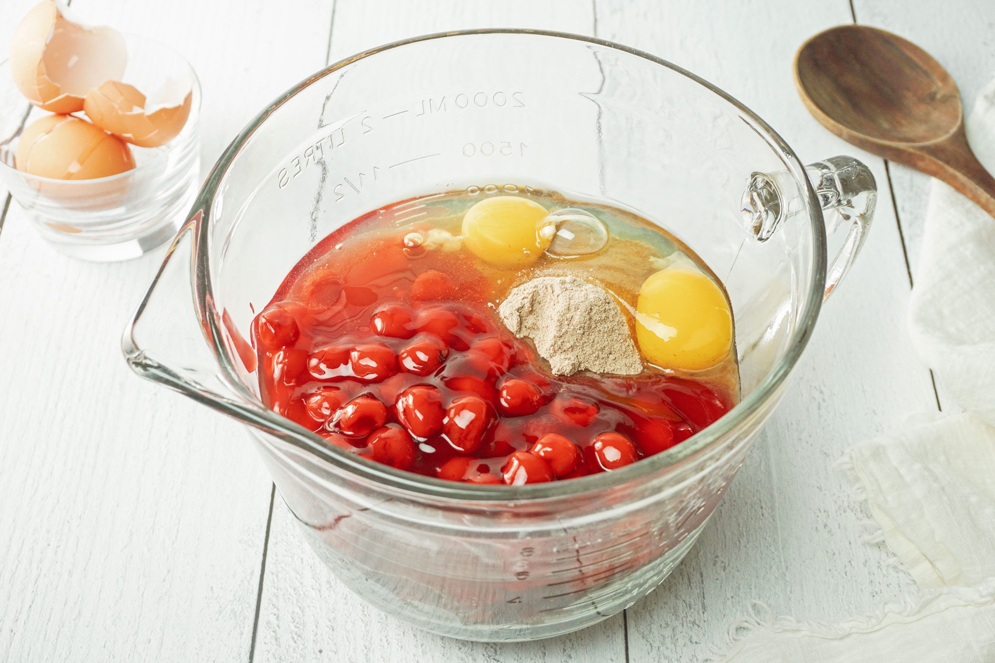 In a large bowl, combine the cake mix, cherry pie filling, eggs and vanilla