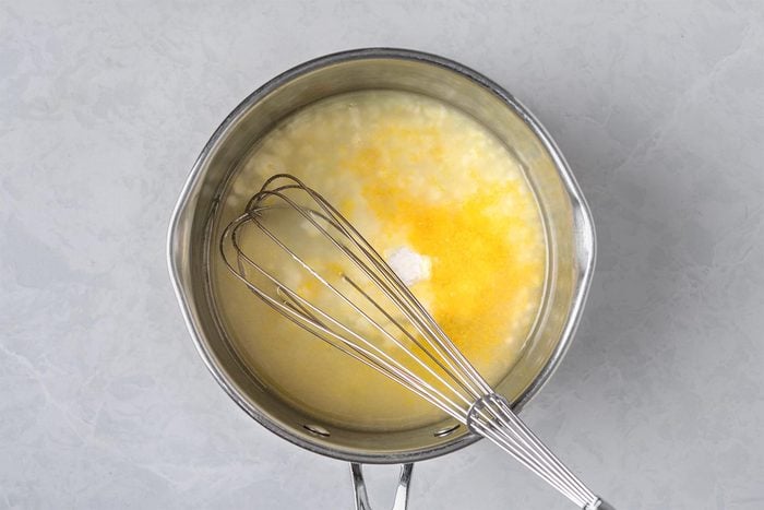 In a large heavy saucepan, mix sugar and cornstarch. Whisk in lemon juice and zest.