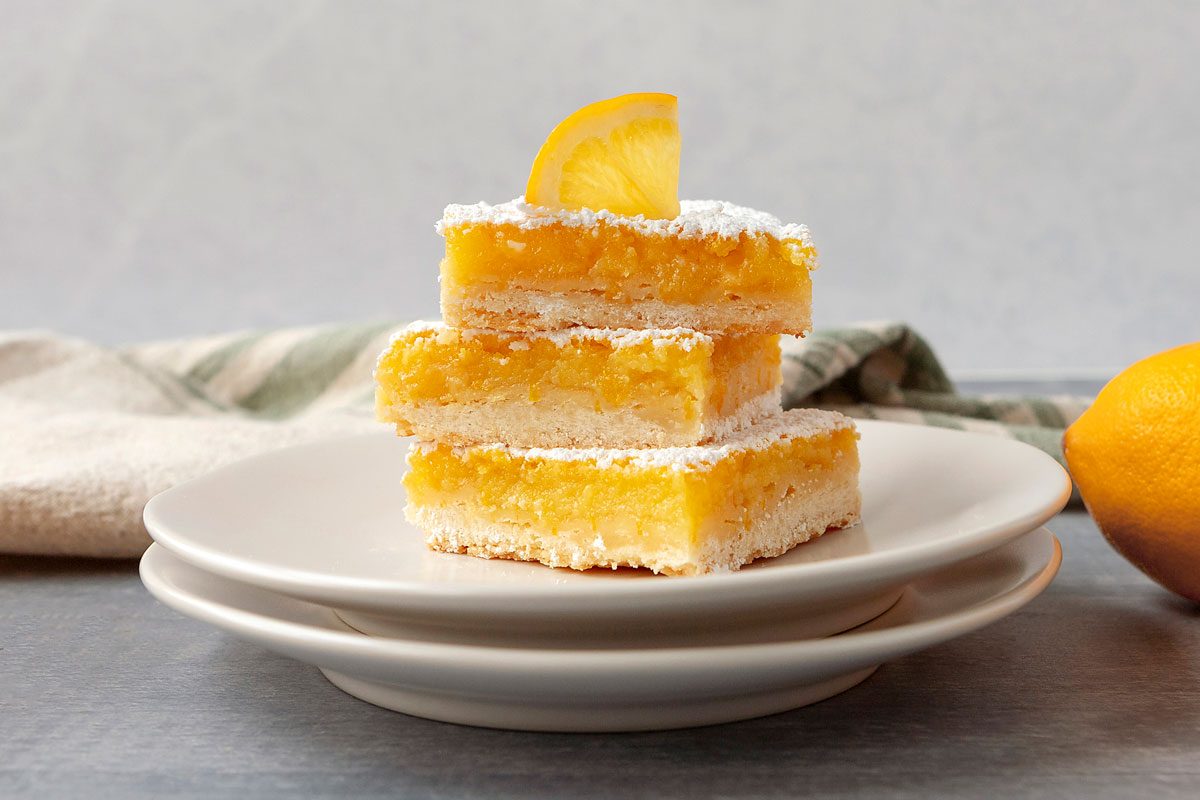 Meyer Lemon Bars stacked on a plate