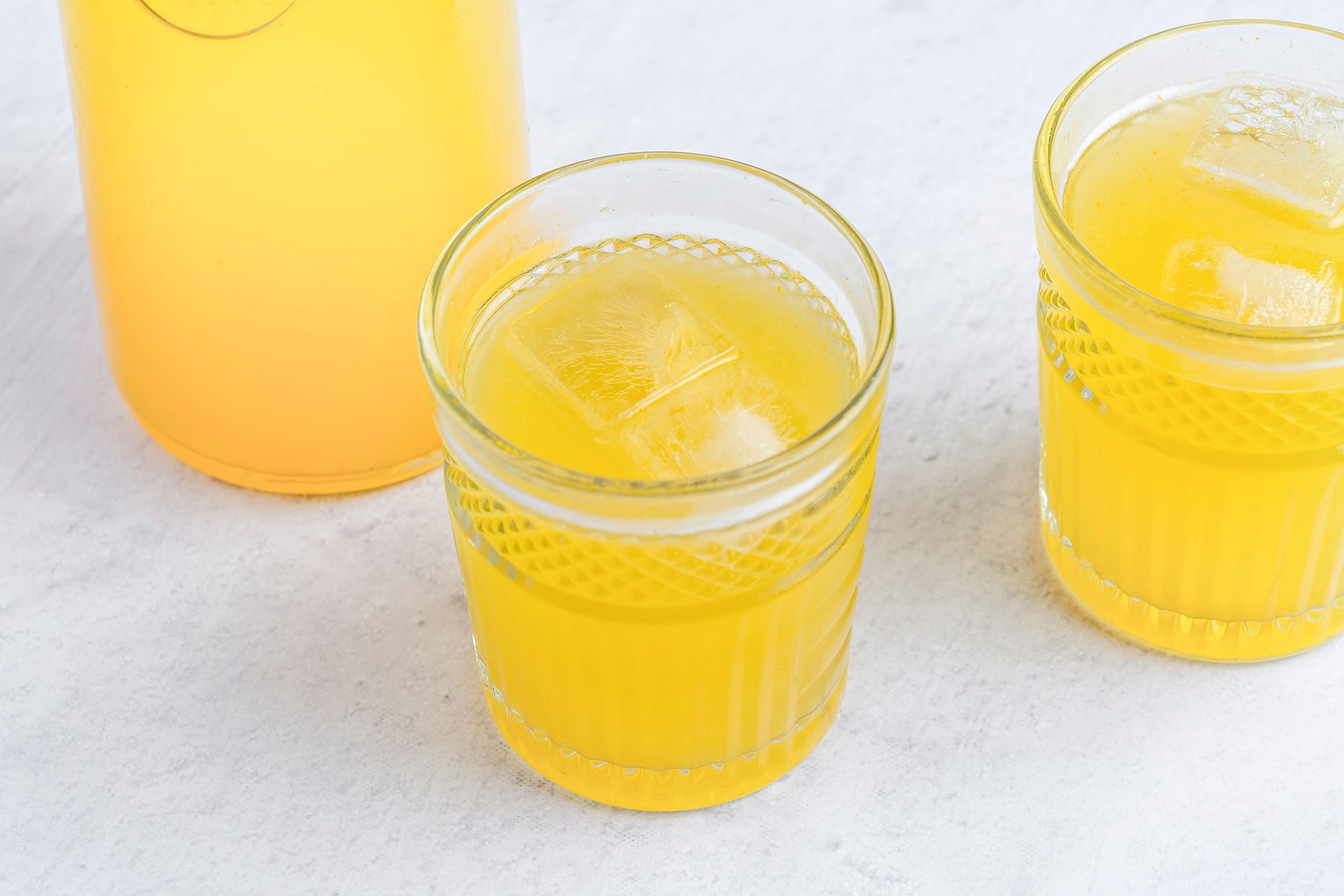 Orange lemonade is ready and served in glasses