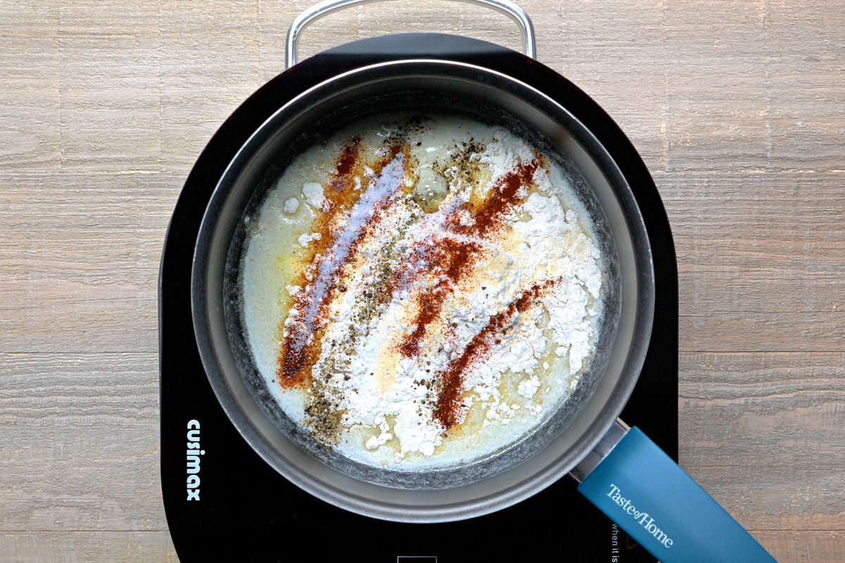 flour, onion powder, chipotle powder, salt and pepper added to melted butter in a large saucepan
