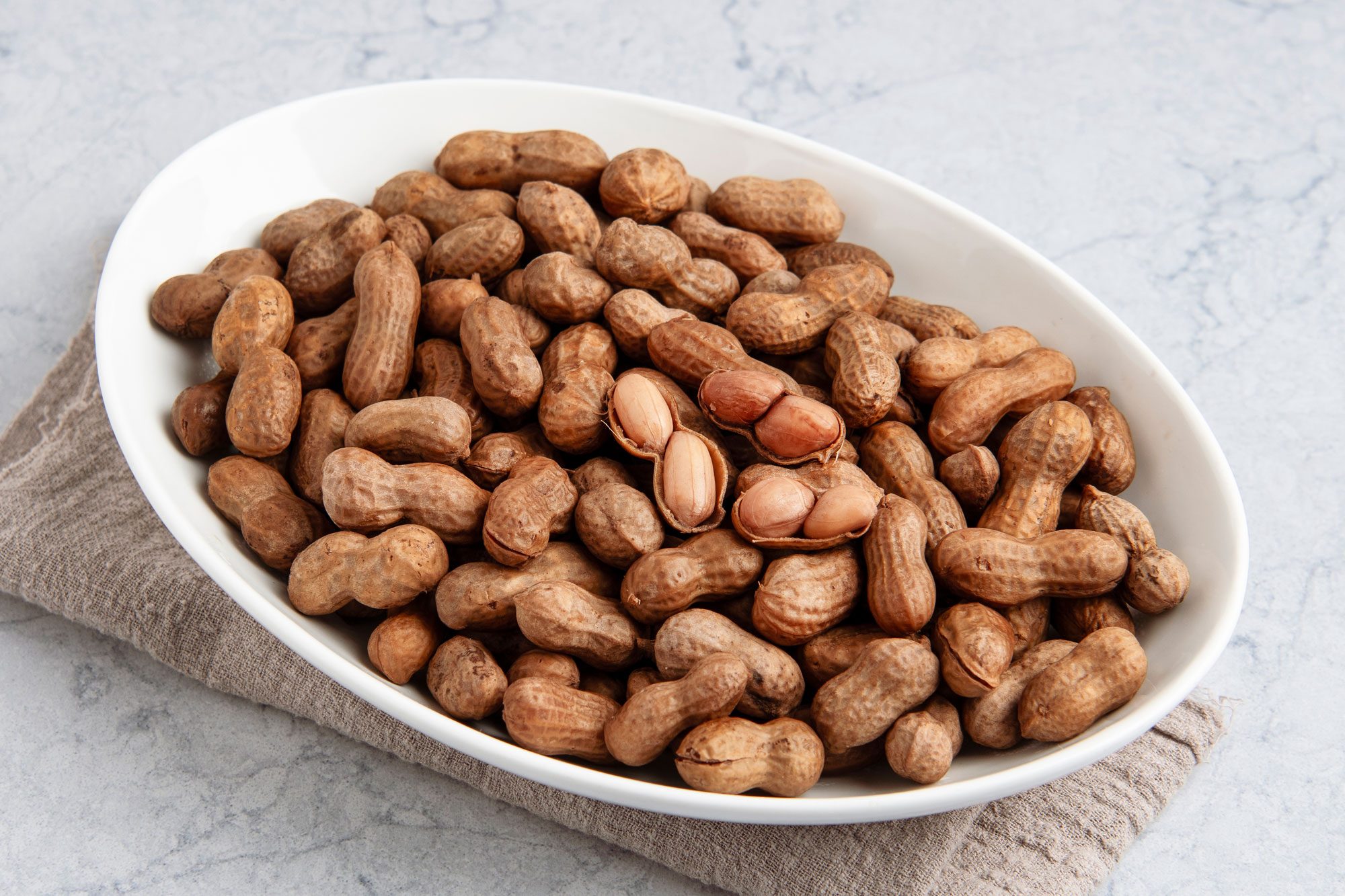 Close shot of Soft Boiled Peanut; serve on platter; napkin; marble surface;