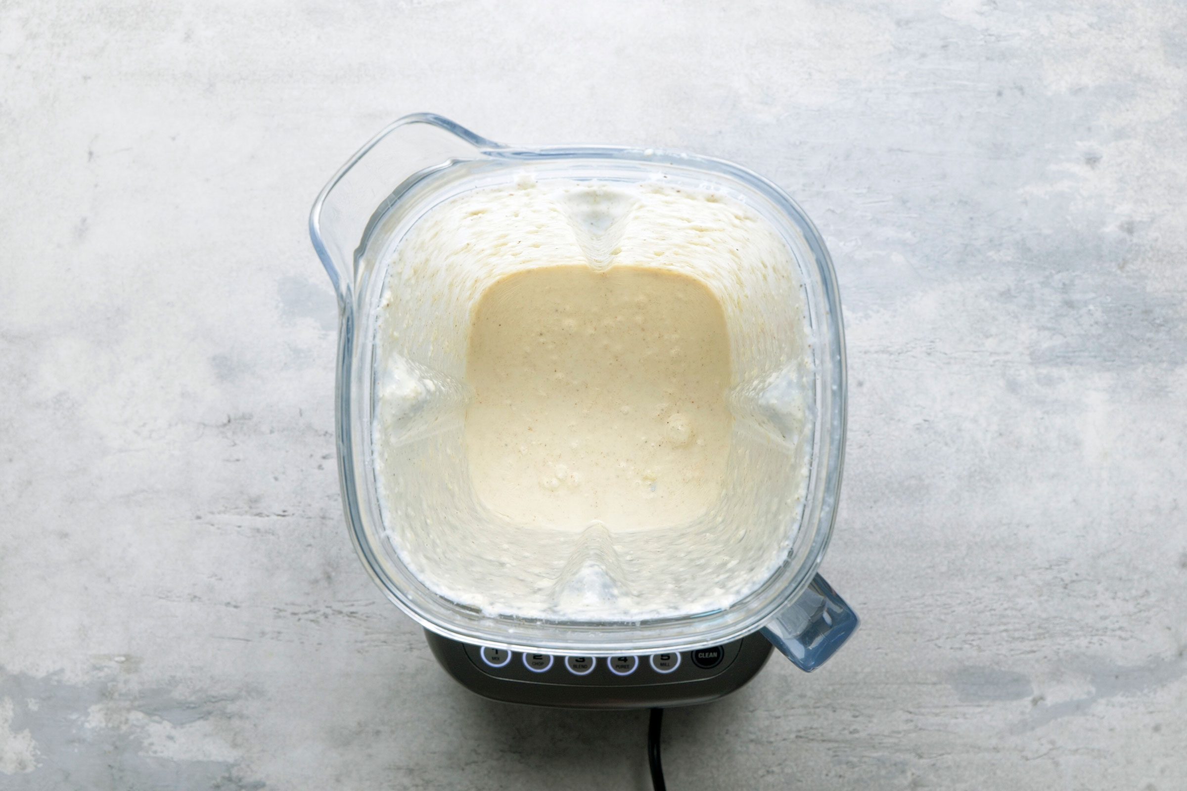 Yogurt, gingerroot, garlic, soaked cashews, ghee, salt and nutmeg in a food processor