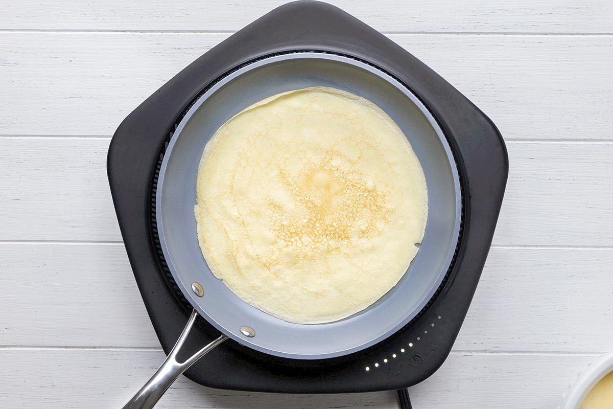 Crepe Cake being cooked on a pan.