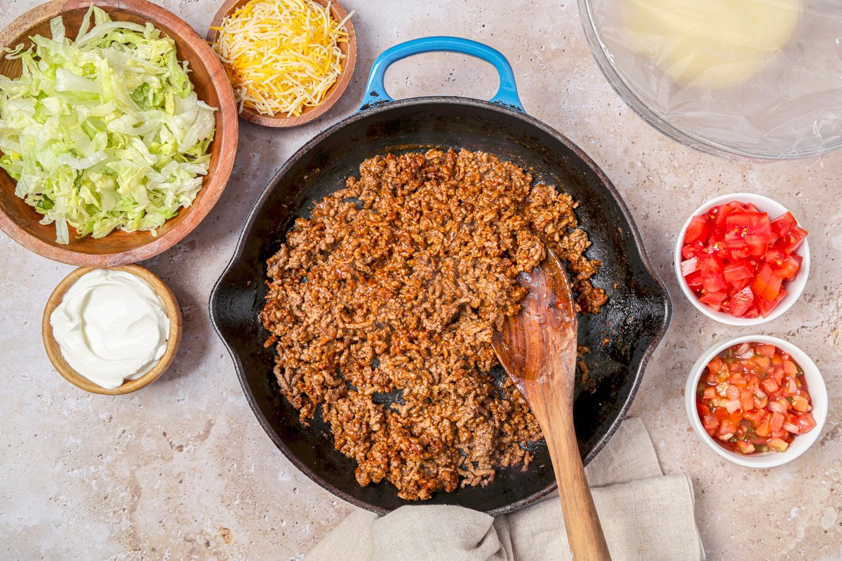 Beef cooking in a large skillet