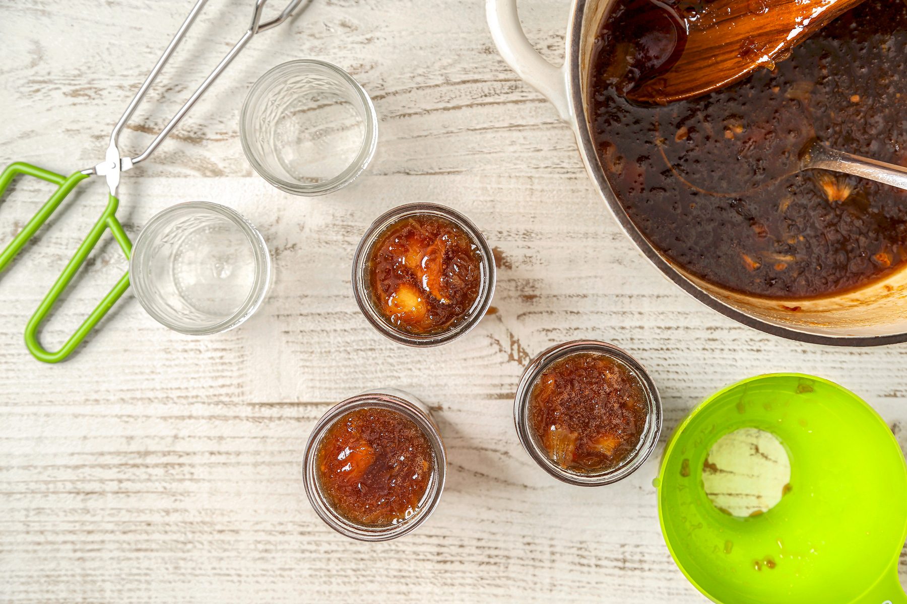 Sterilized jars filled with homemade onion jam