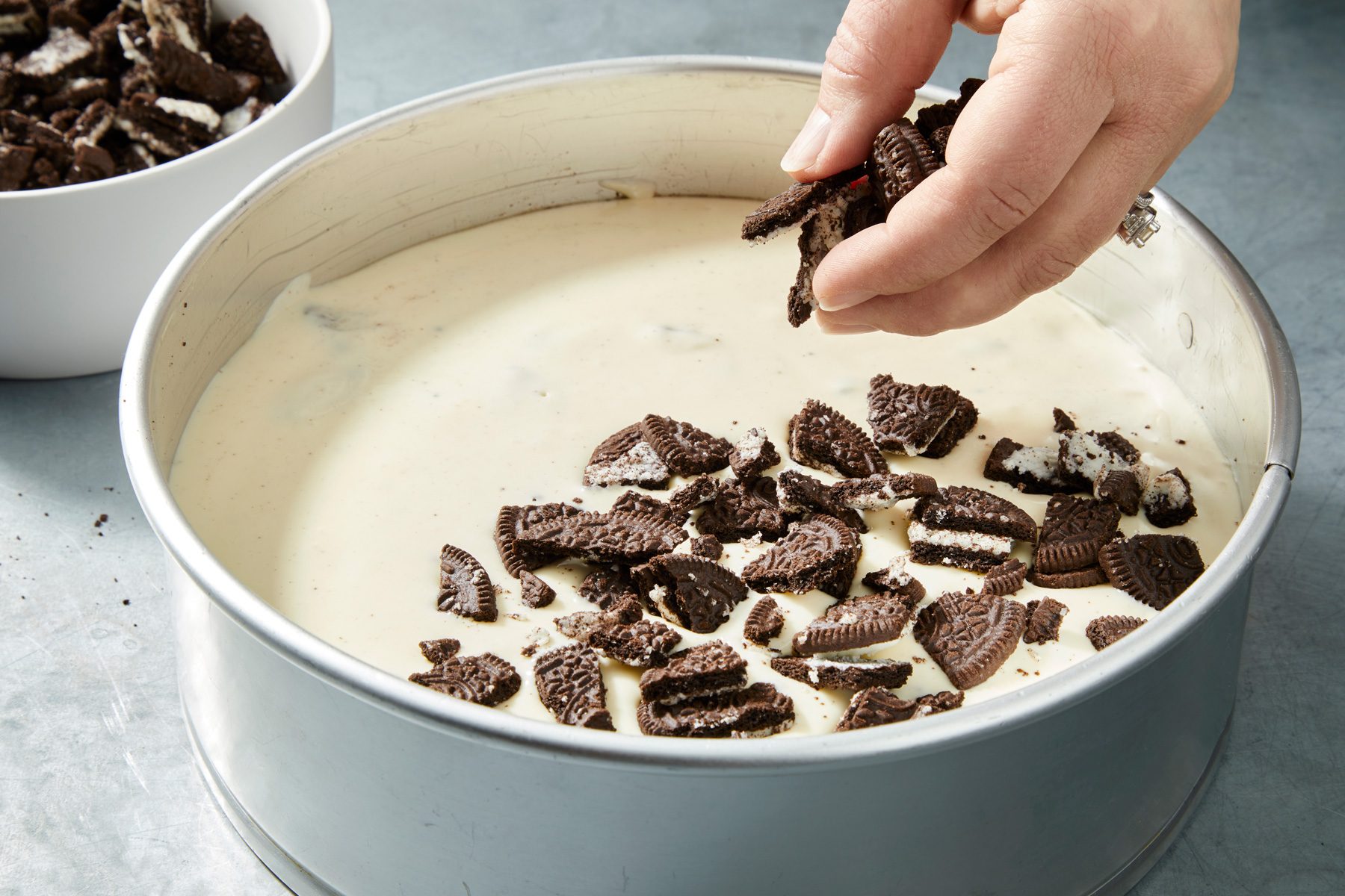 Close-up shot of the top of the jar with the remaining chopped cookies; on a grey surface;