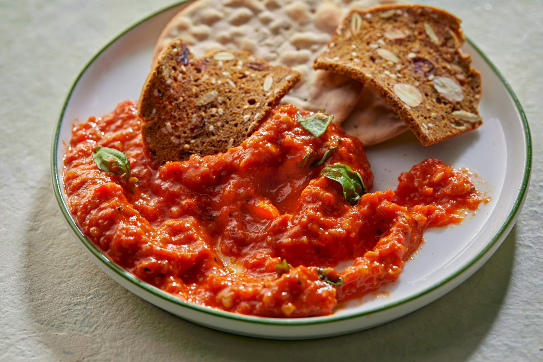 Close up shot of Red Pepper Tapenade served with crackers