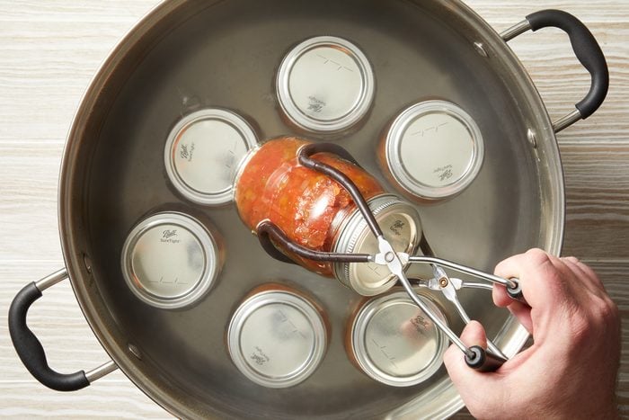 jars of relish being processed in a boiling-water canner