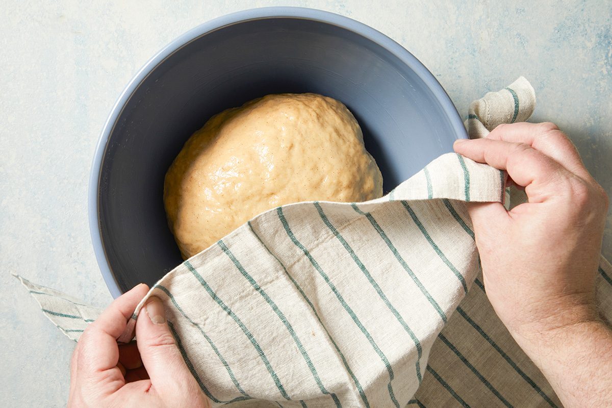 Overhead shot of place in a greased bowl; turning once to grease the top; Cover and let rise in a warm place until doubled about 1 hour