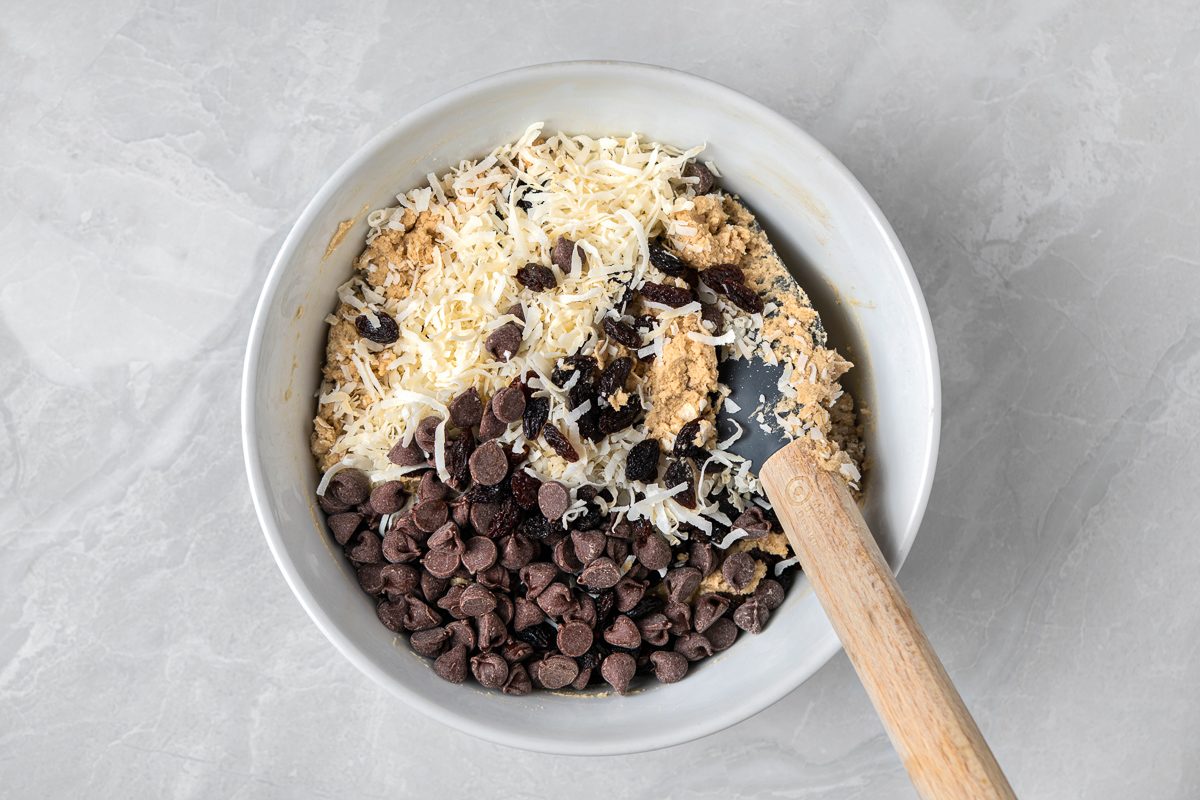 flour, oats, baking soda, cinnamon, salt, raisins, coconut and chocolate chips mixed with cream butter mixture