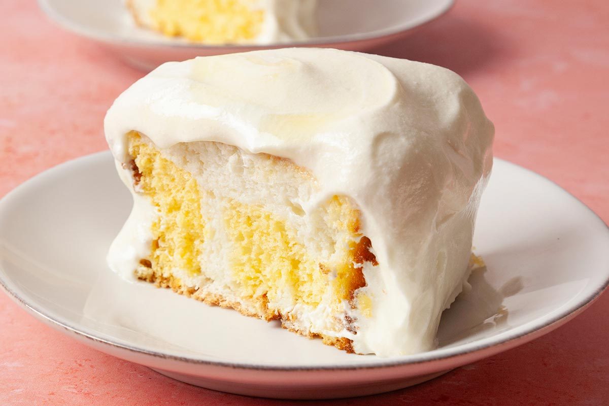 A piece of Daffodil Cake presented on a white plate, ready to eat