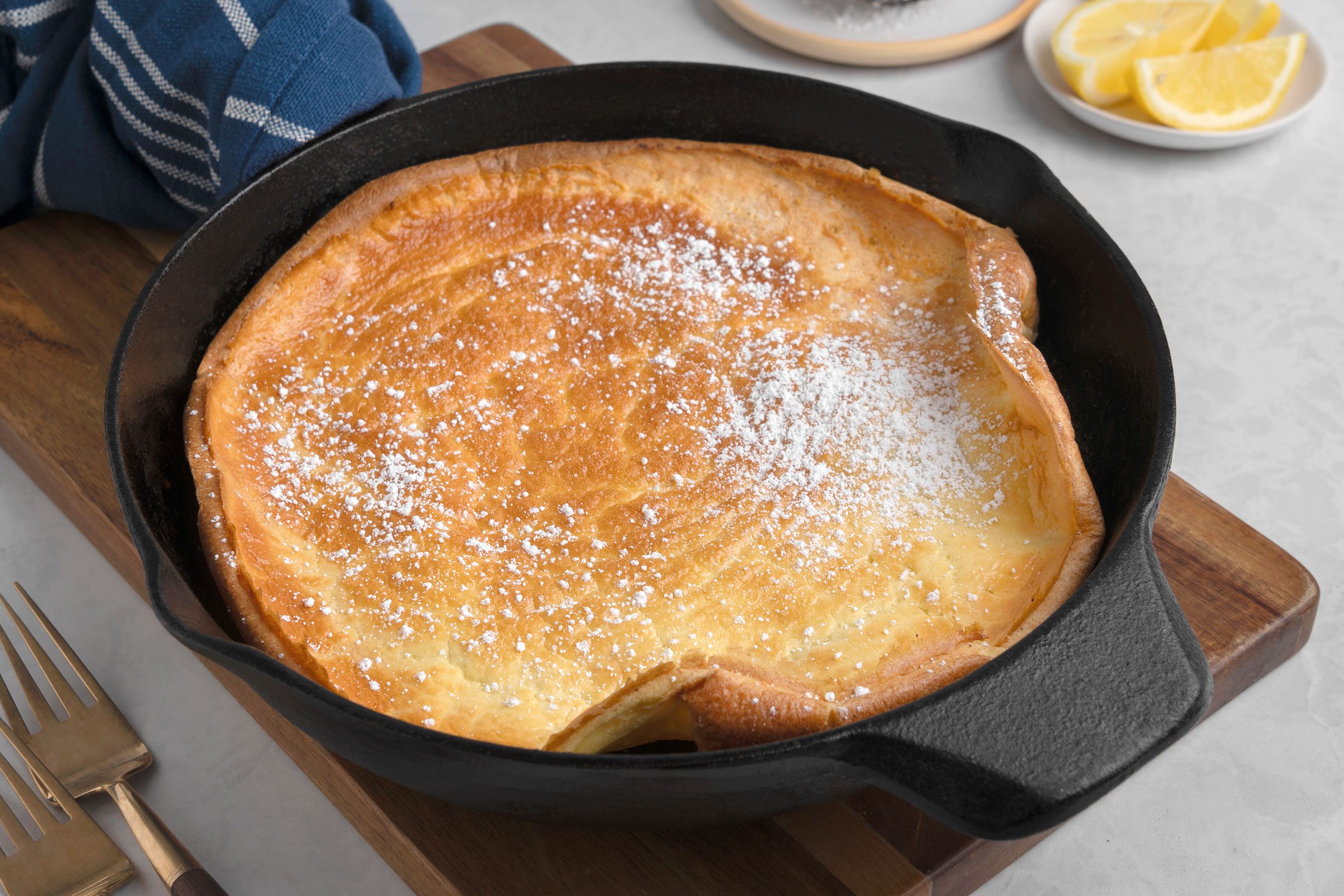 Dutch Baby Pancake with lemon wedges on side