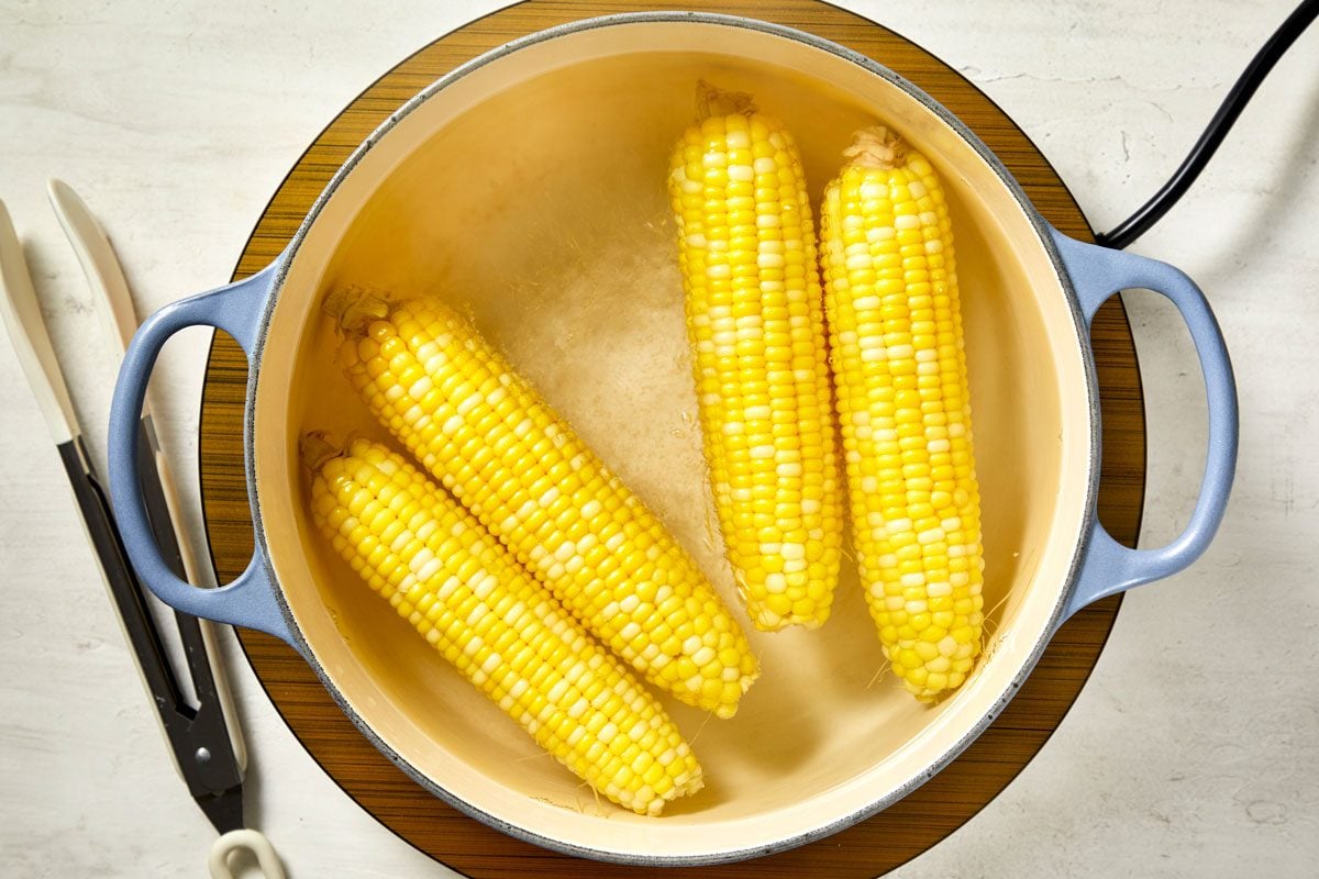 In a pot of boiling water, cook corn until tender