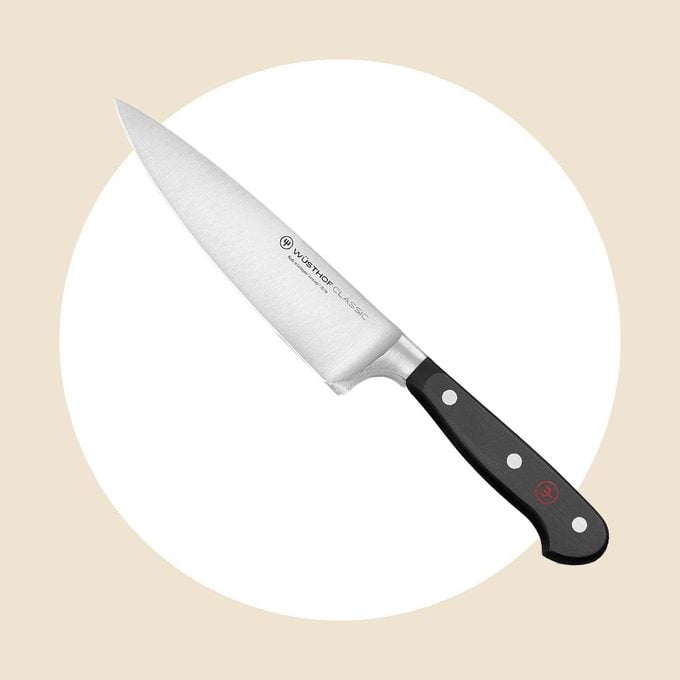 Wusthof Classic Chefs Knife 6 inch on a white and tan background