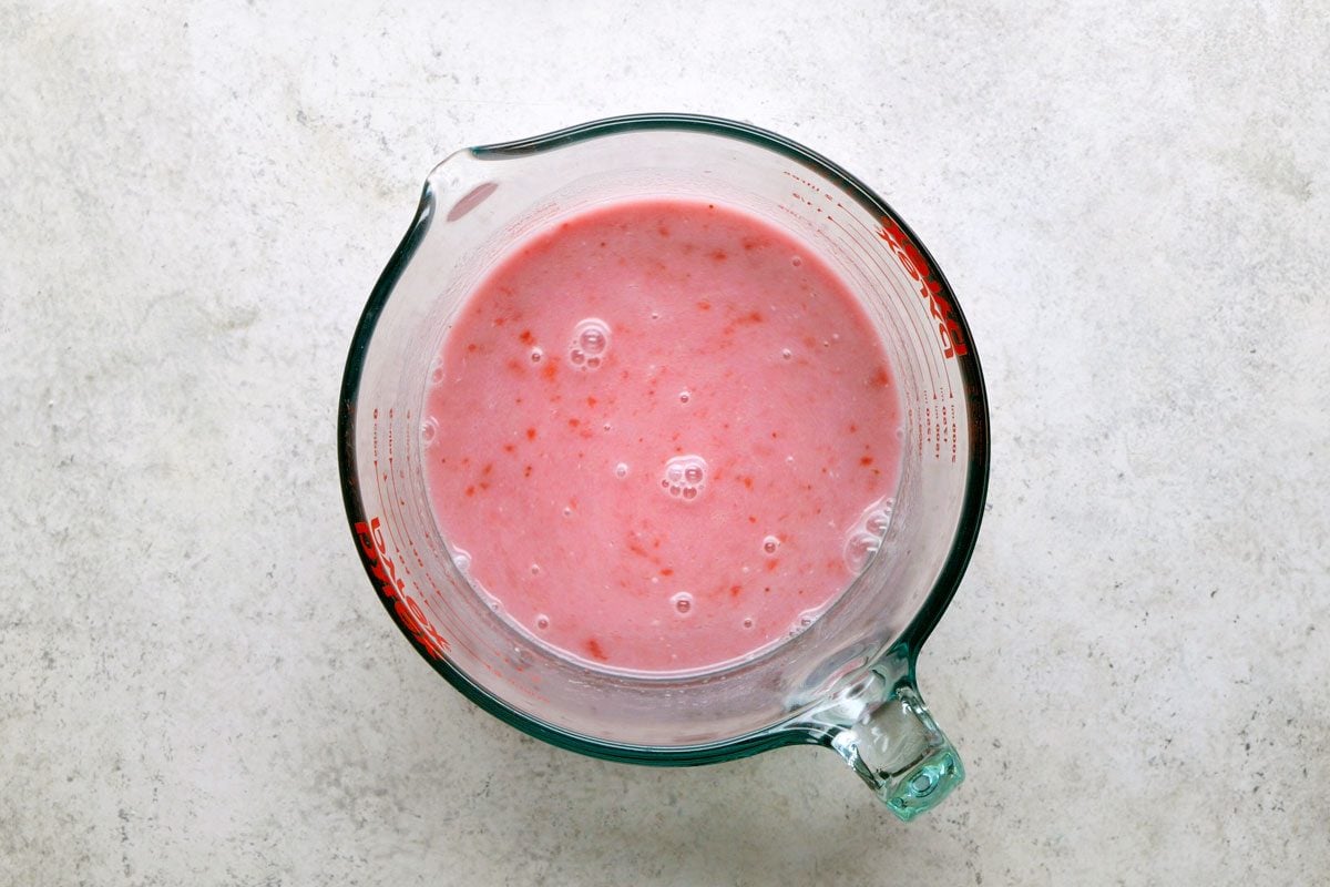 Mix together strawberry mixture; tea; coconut milk and simple syrup in a jar
