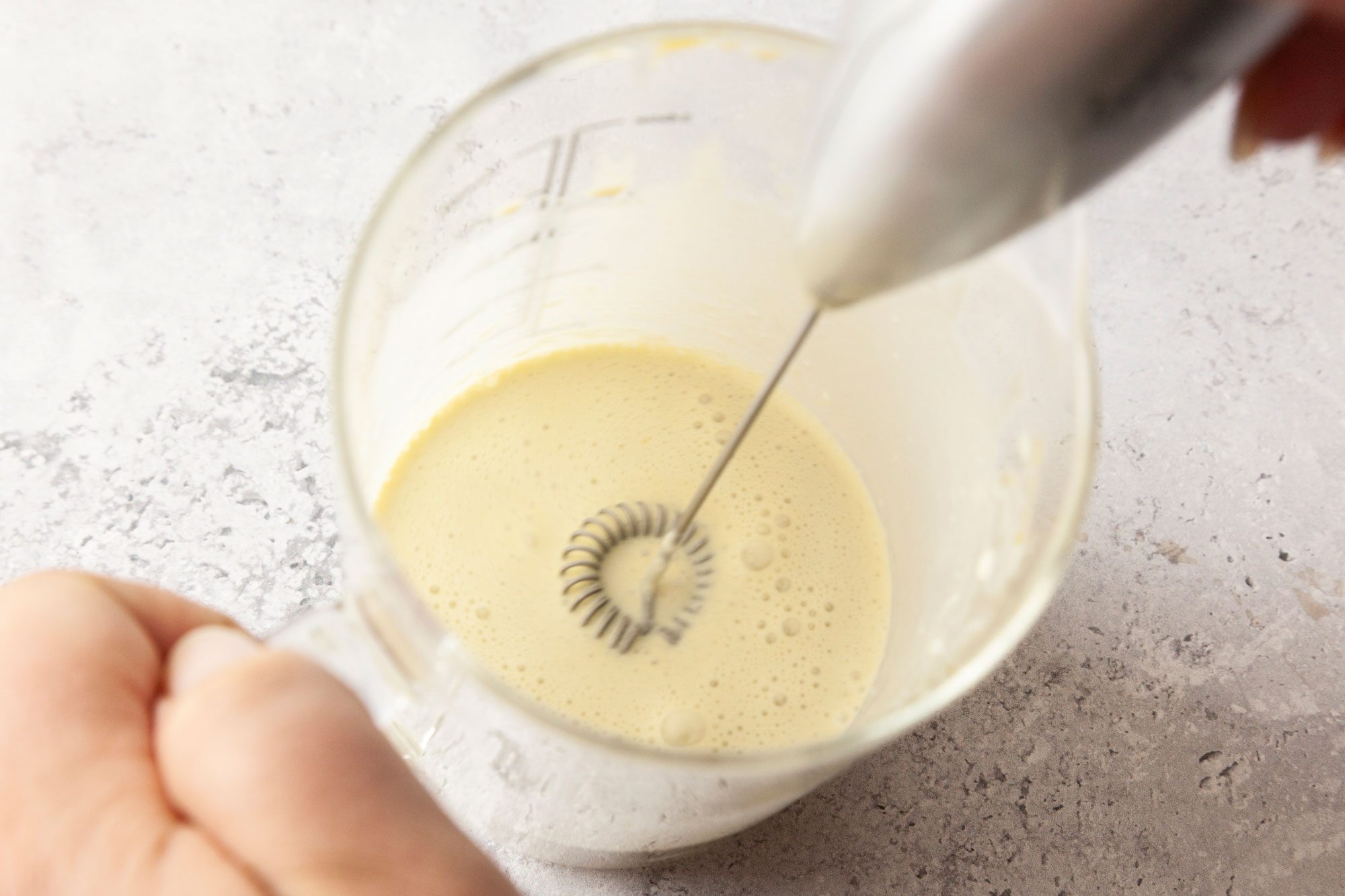 To the remaining pistachio and tahini mixture add heavy cream 1 tablespoon at a time; whisking after each addition until smooth