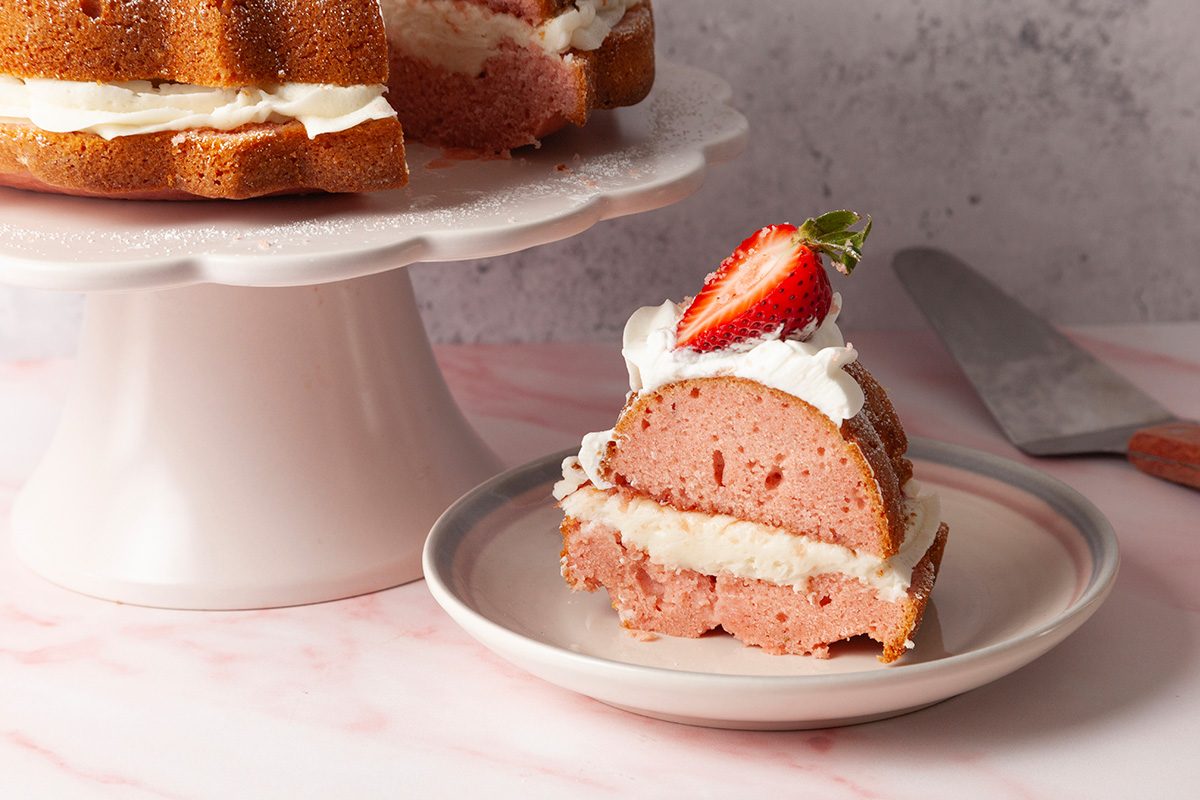 Layered Strawberry Bundt Cake is ready and served in a plate