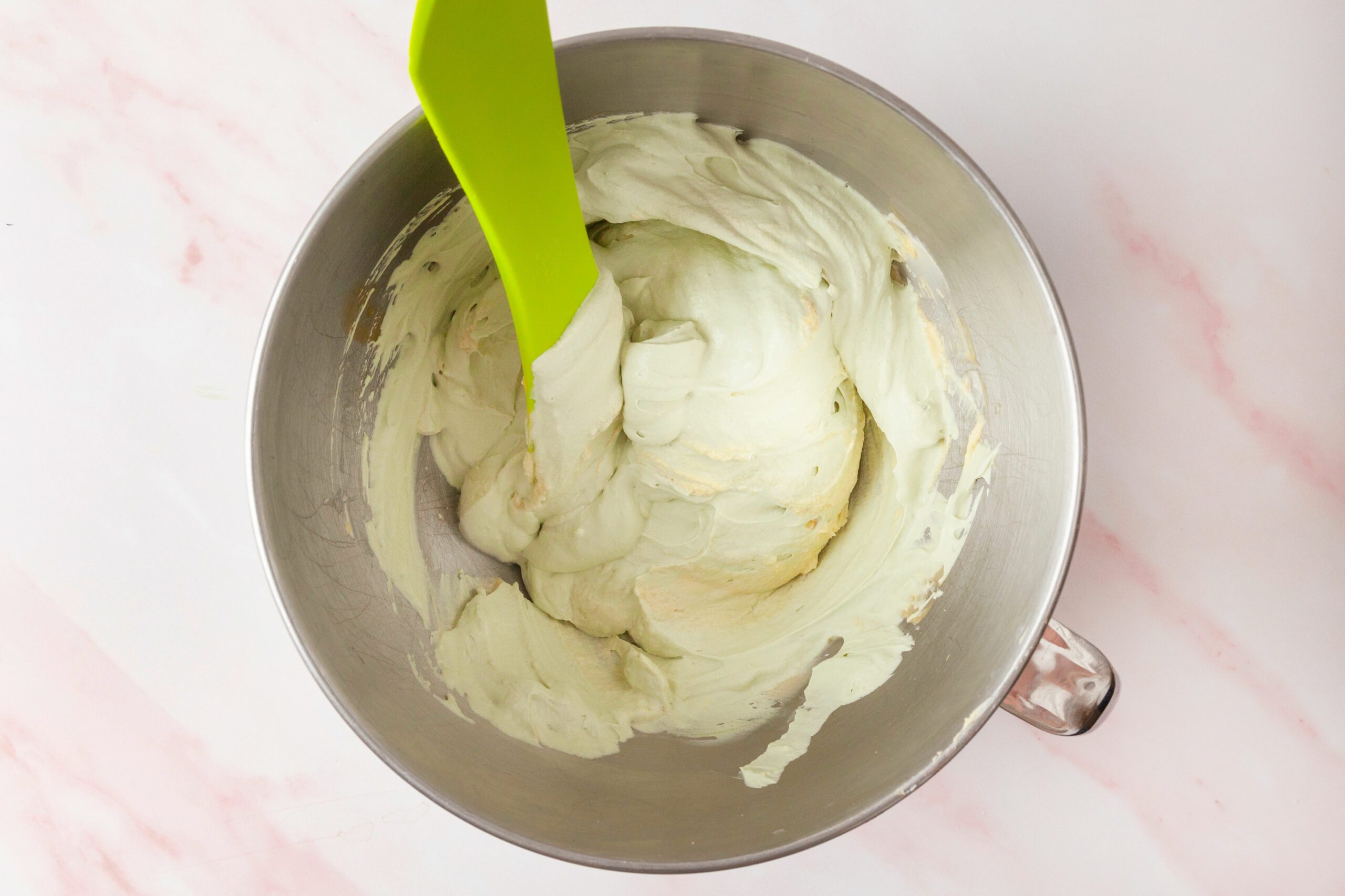 whipped cream being folded into the mascarpone mixture