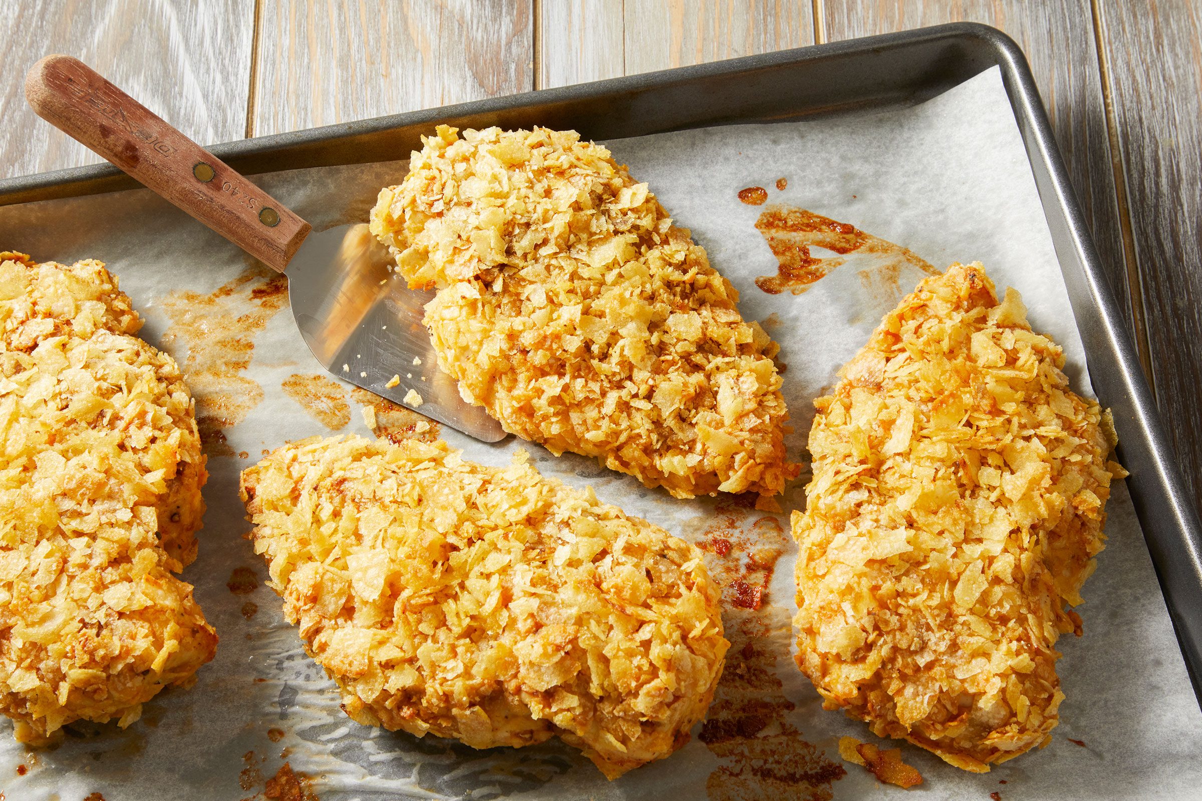Baked Potato Chip Chicken on foil-lined baking sheets