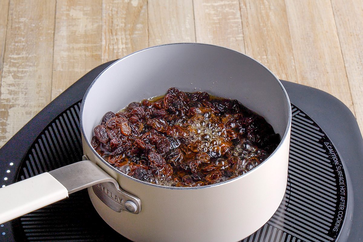 Combine water and raisins in a small saucepan; bring to a boil