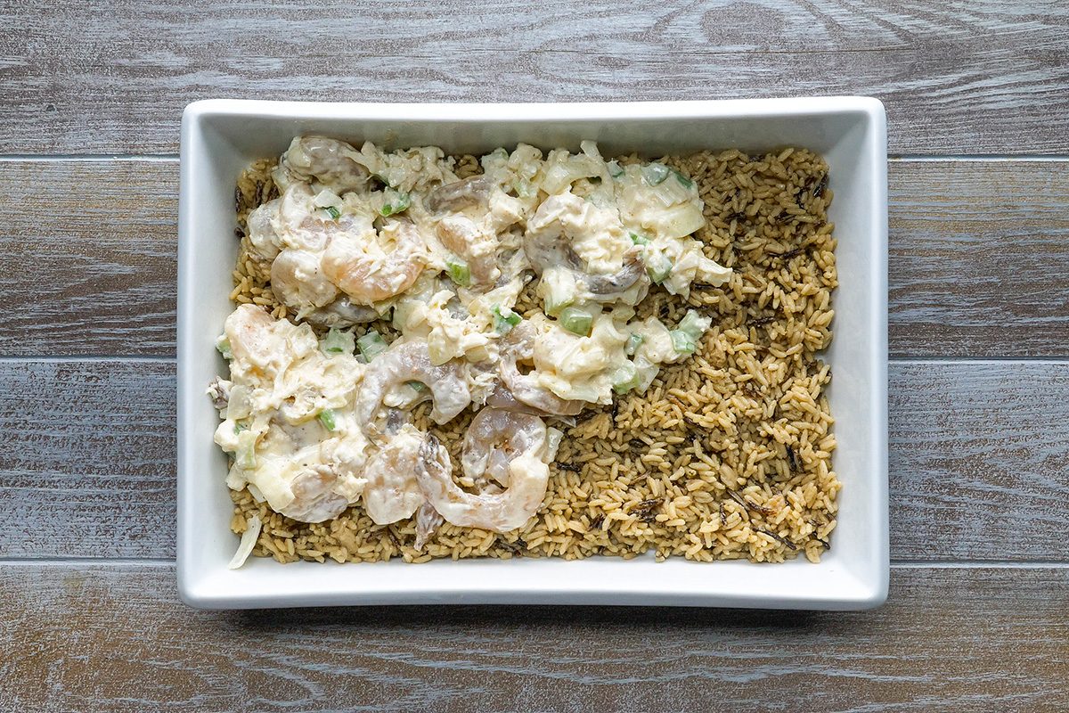 Pour the shrimp mixture onto the rice in baking dish