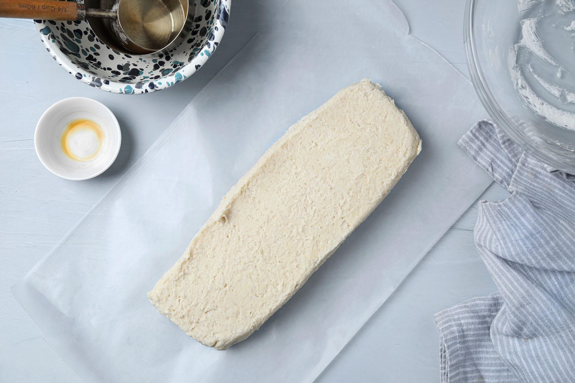 Using a sheet of waxed paper shape dough into a rectangle; Wrap in waxed paper