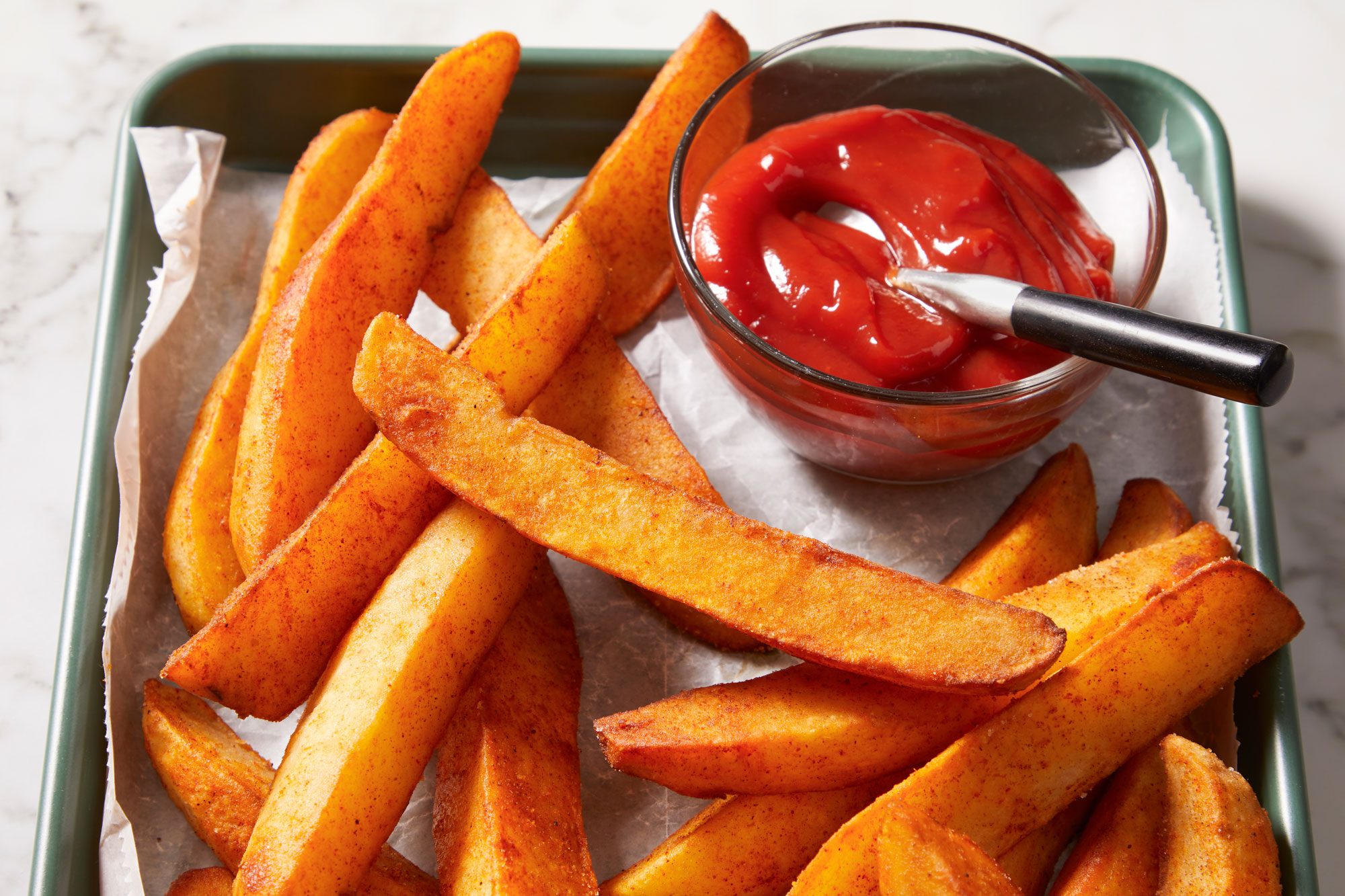 3/4 shot of Jojos served with ketchup