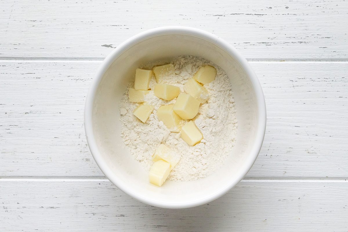 butter added to sugar and flour mixture for topping