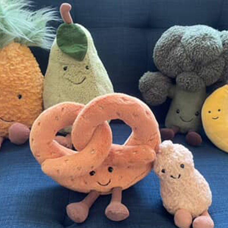 Jellycats toys placed on a blue coloured chair