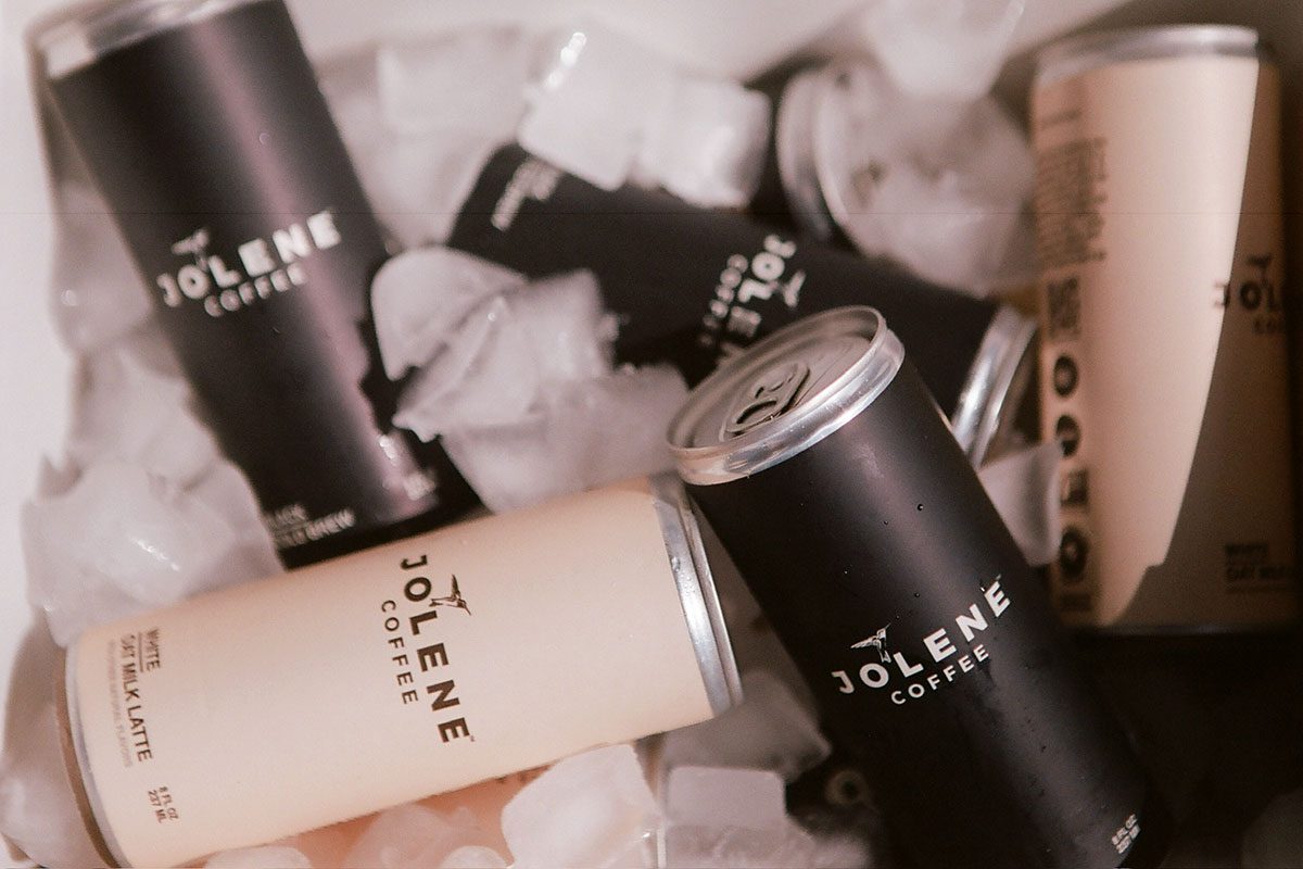 Cans of Jolene coffee sitting in ice