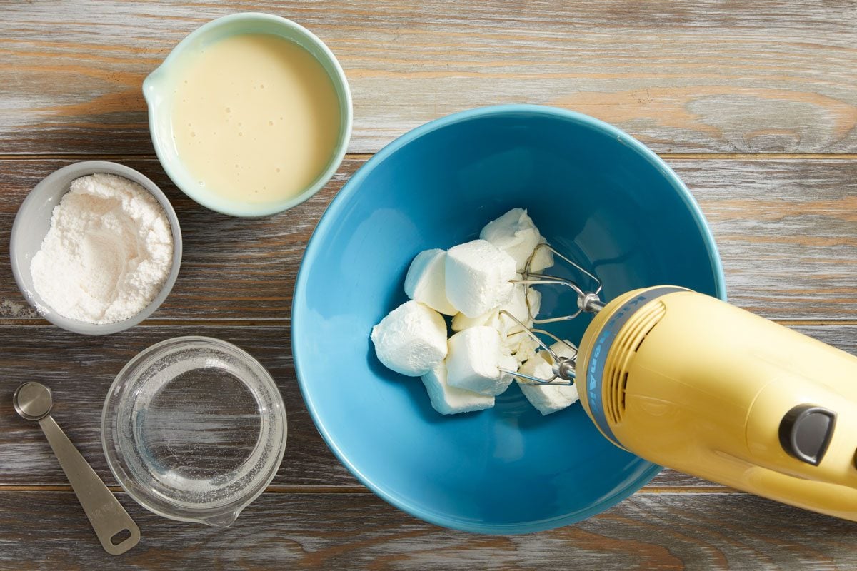 In a large bowl, beat cream cheese until fluffy.