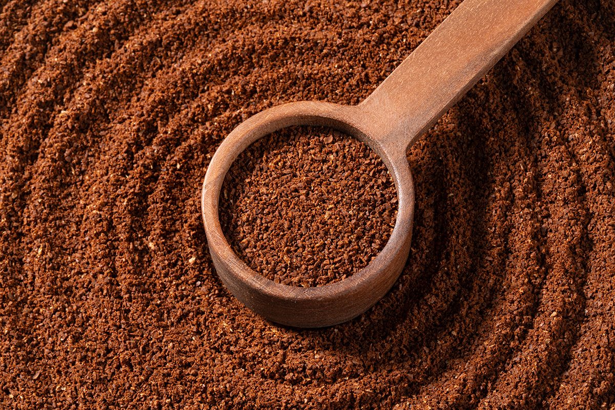 Ground Coffee in Wooden Spoon High Angle View