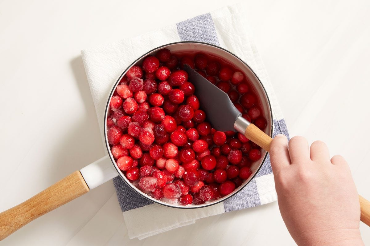 place cranberries, sugar, and orange juice in a large saucepan.