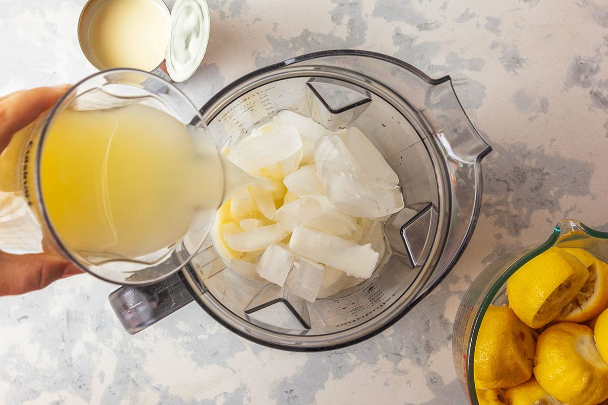 blender, combine the ice, heavy whipping cream, freshly squeezed lemon juice and sweetened condensed milk