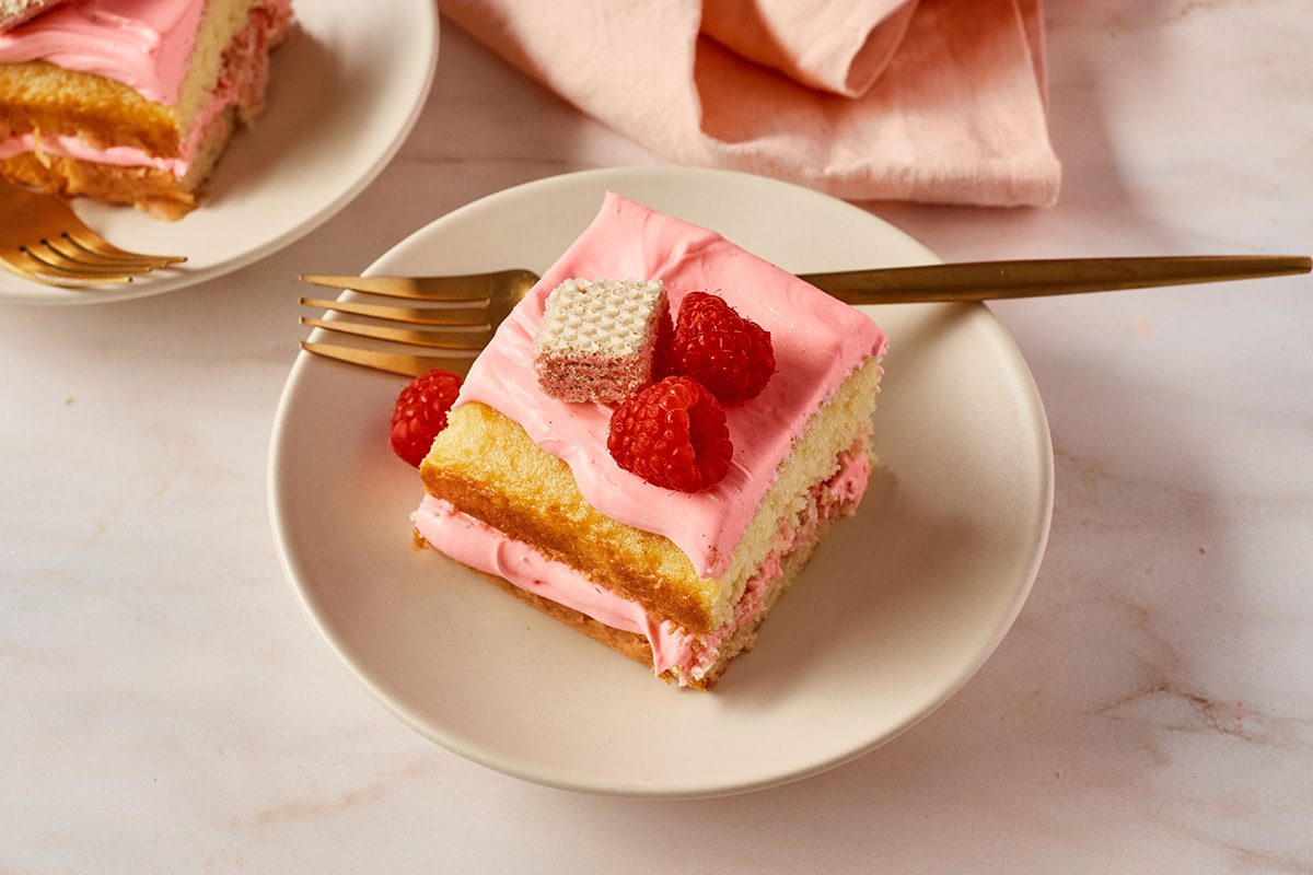 Giada De Laurentiis Lemon Raspberry Sheet Cake Page Plate X Lemon Raspberry Sheet Cake in a plate with a fork on the side