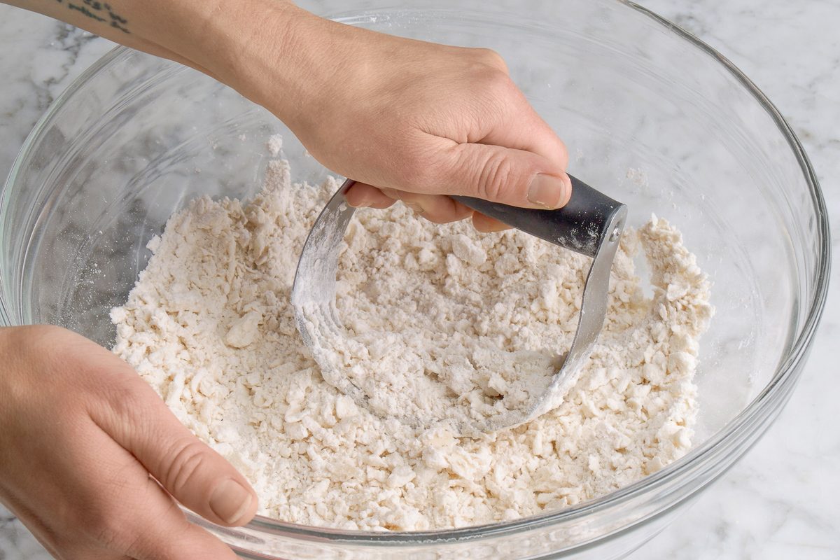 adding shortening to flour mixture