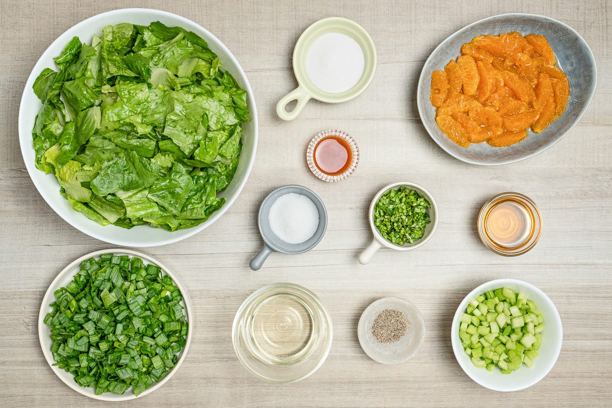 dressing, romaine, oranges, celery, green onions and parsley