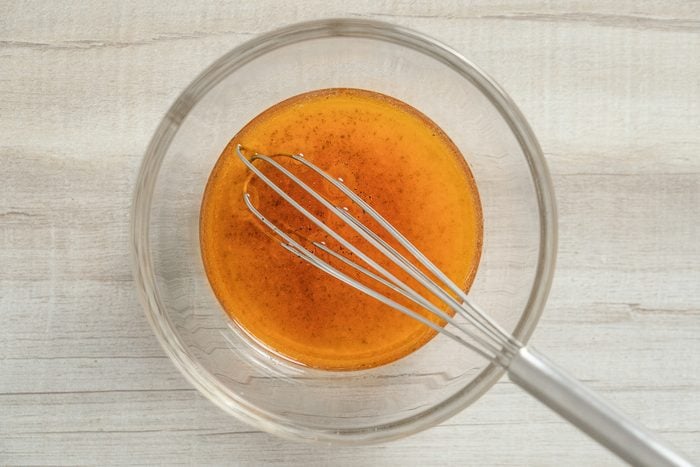 canola oil, sugar, tarragon vinegar, salt, hot pepper sauce and pepper mixed in a bowl