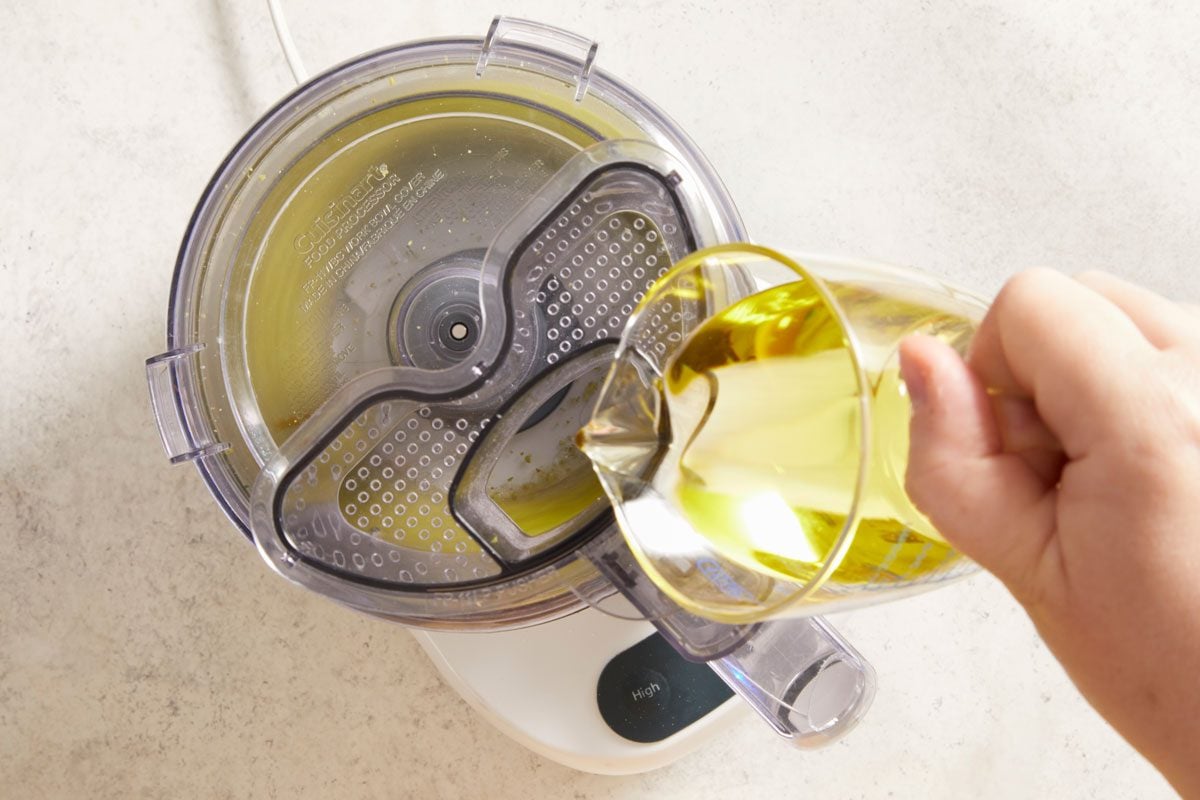 While processing, gradually add oil in a steady stream.