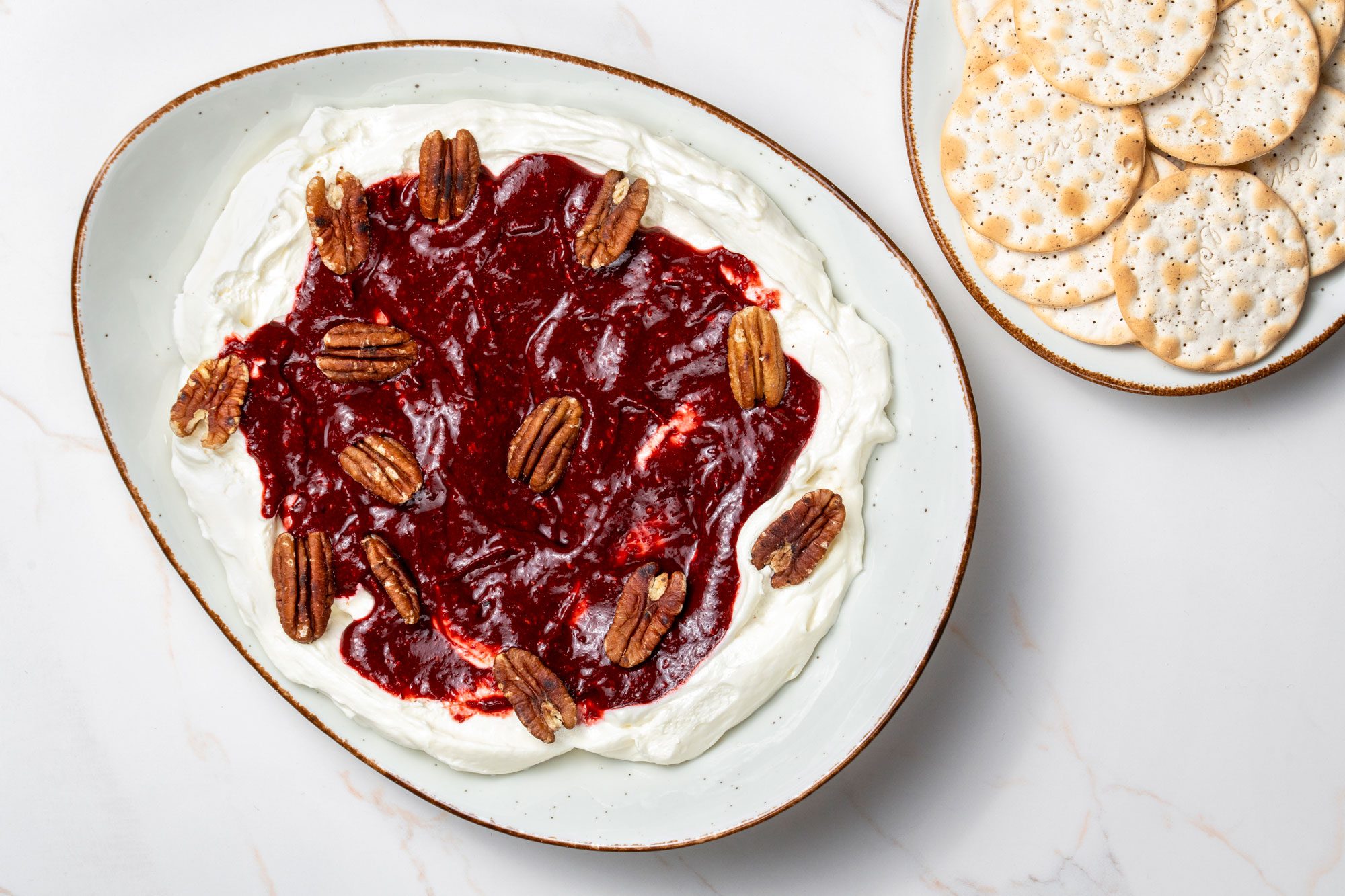 Overhead shot of Raspberry Chipotle Dip served with crackers