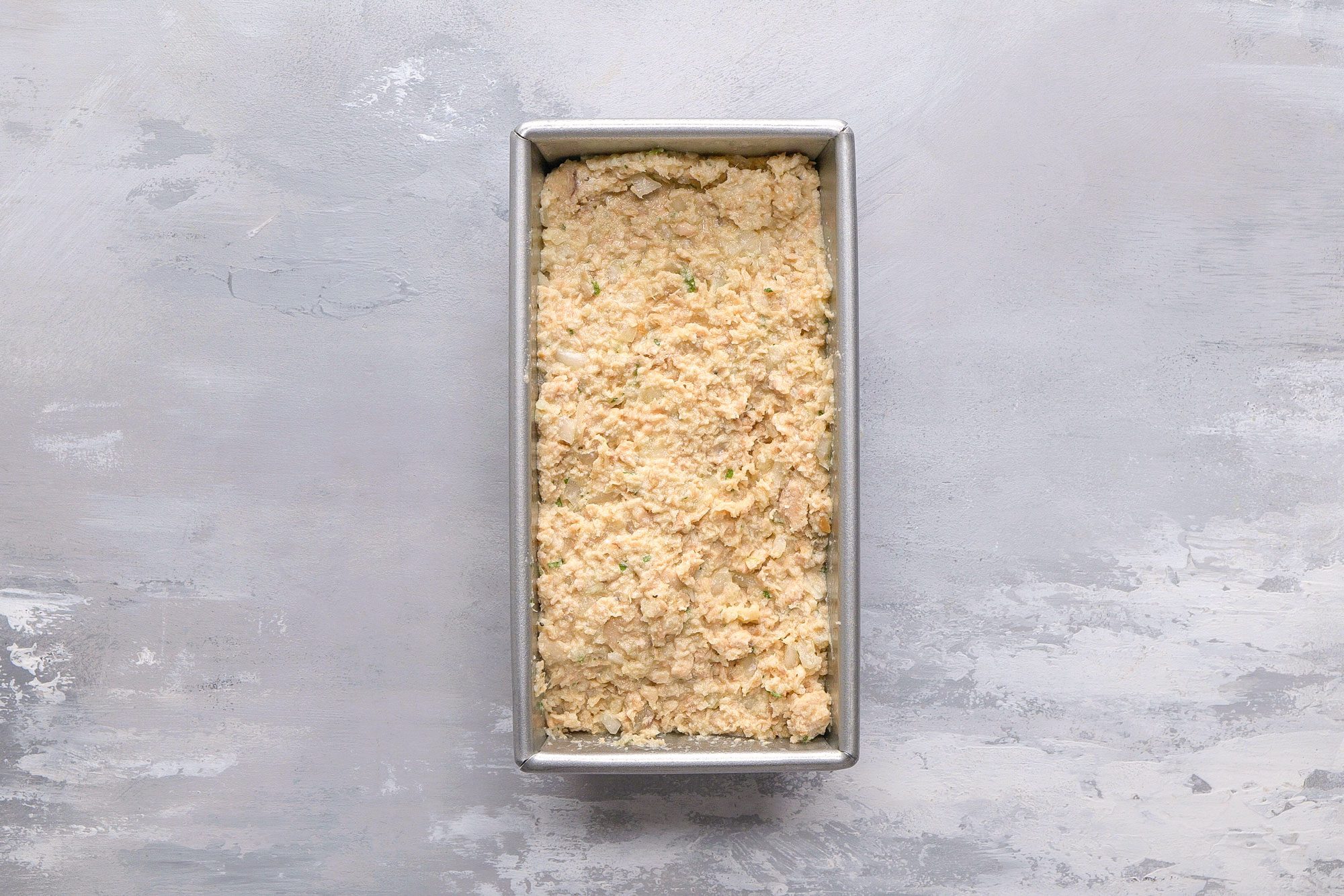 Transfer to a greased 8x4-in. loaf pan.