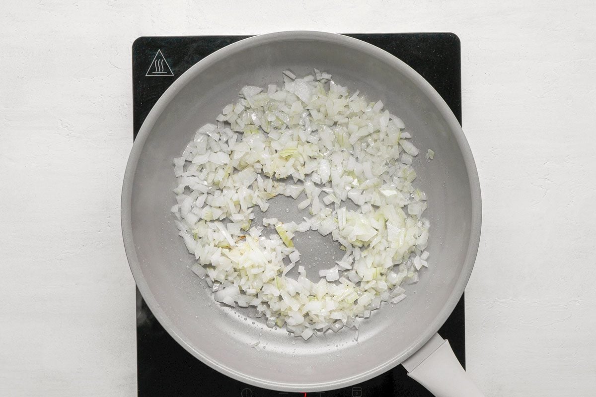 In a small skillet, saute onion in oil until tender. Add oregano and garlic;